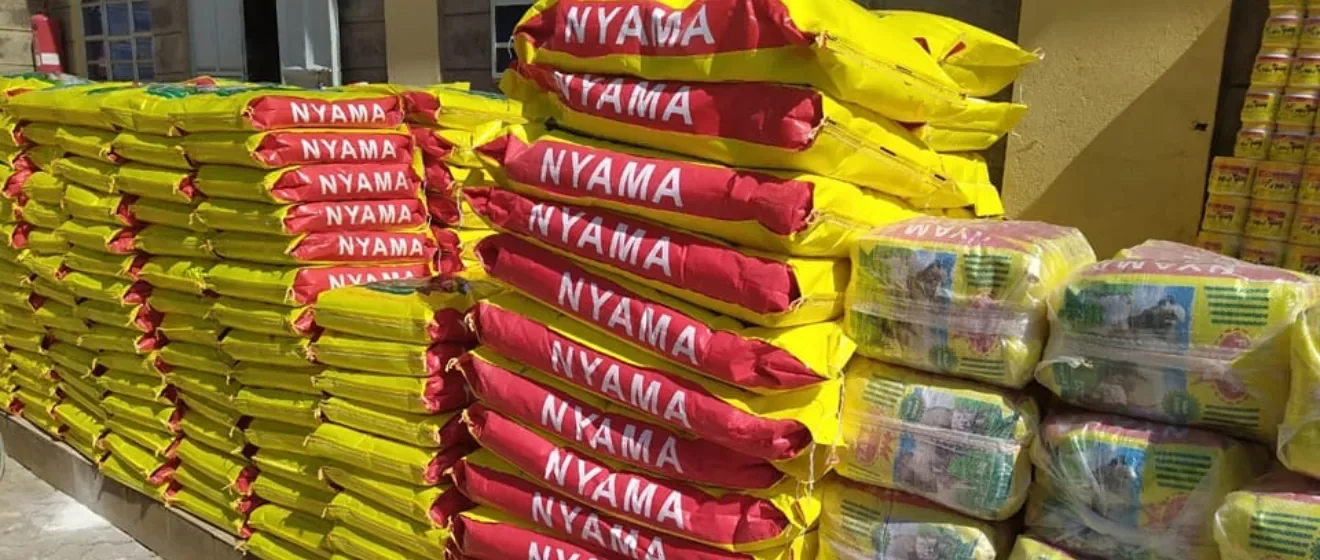 Stacks of yellow and red FAMAS feed sacks and packed Dairy bags ready for dispatch
